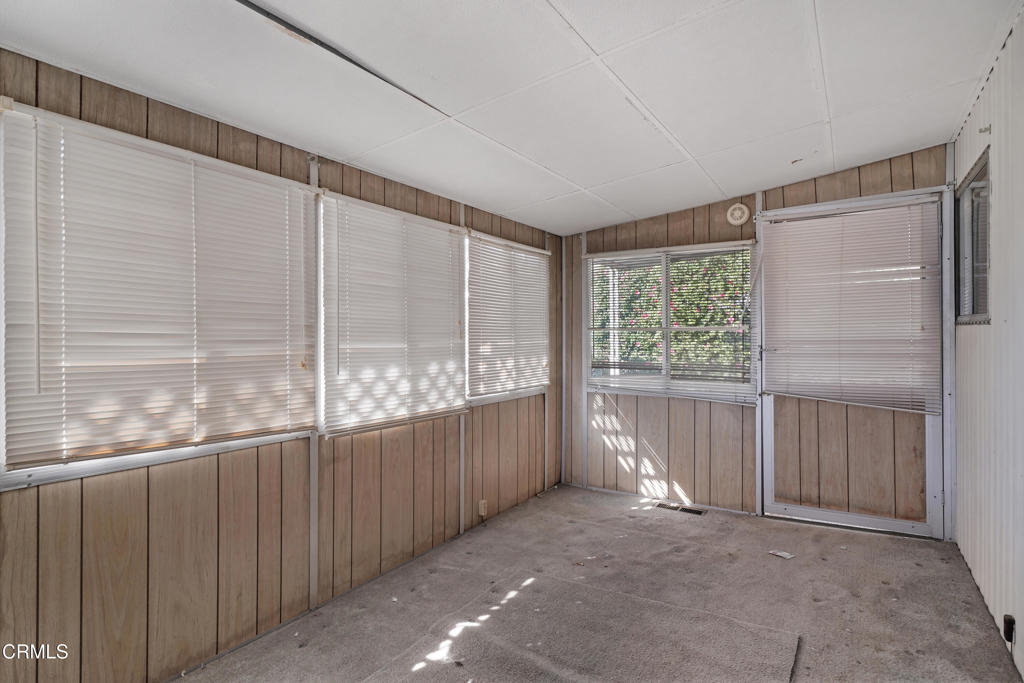 250 East Telegraph Road, Unit 221 Fillmore, CA 93015 - Photo 12 of 18 a view of a room with sliding glass door