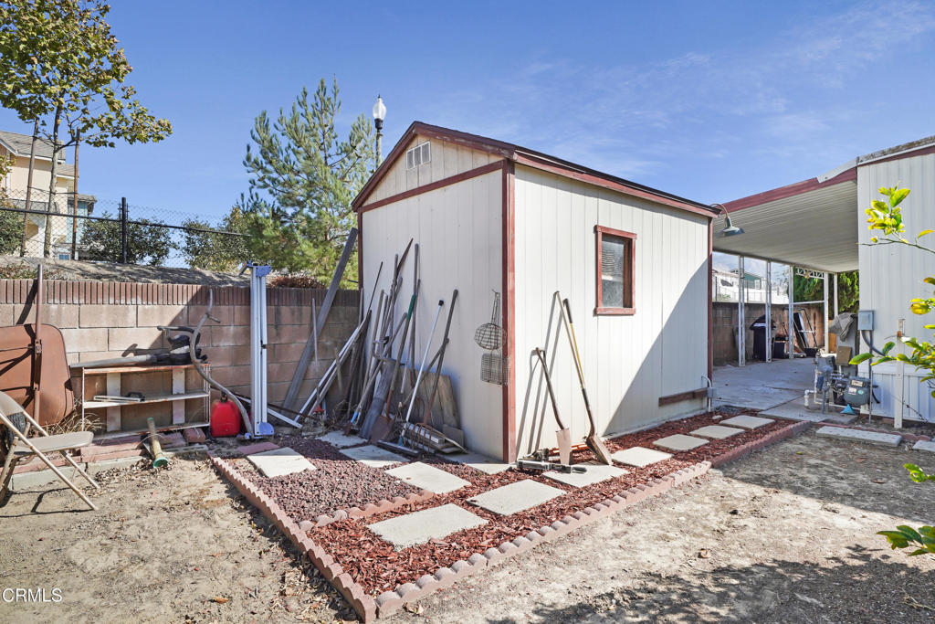 250 East Telegraph Road, Unit 221 Fillmore, CA 93015 - Photo 15 of 18 a view of a house with a backyard