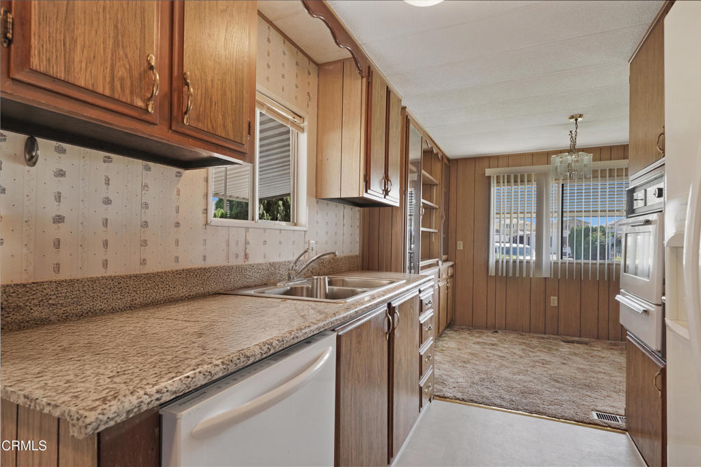 250 East Telegraph Road, Unit 221 Fillmore, CA 93015 - Photo 3 of 18 a kitchen with a sink stove and cabinets