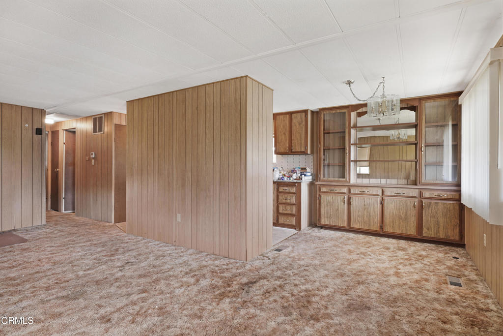 250 East Telegraph Road, Unit 221 Fillmore, CA 93015 - Photo 5 of 18 a kitchen with stainless steel appliances a refrigerator and cabinets