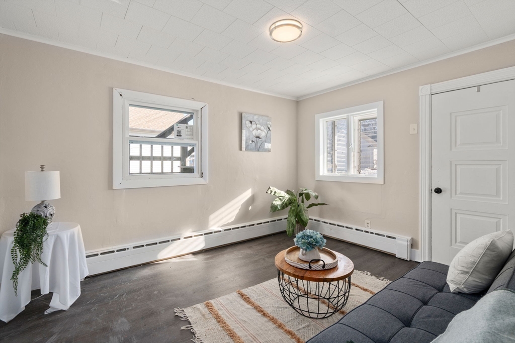 27 Dresser Street Webster, MA 01570 - Photo 11 of 33 a living room with furniture and a potted plant