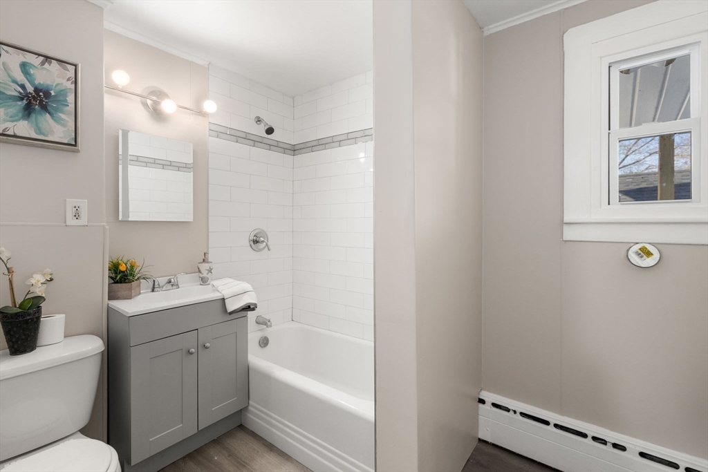 27 Dresser Street Webster, MA 01570 - Photo 16 of 33 a bathroom with a tub sink toilet and a mirror