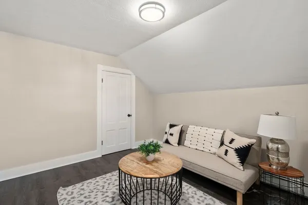 a living room with furniture and a rug