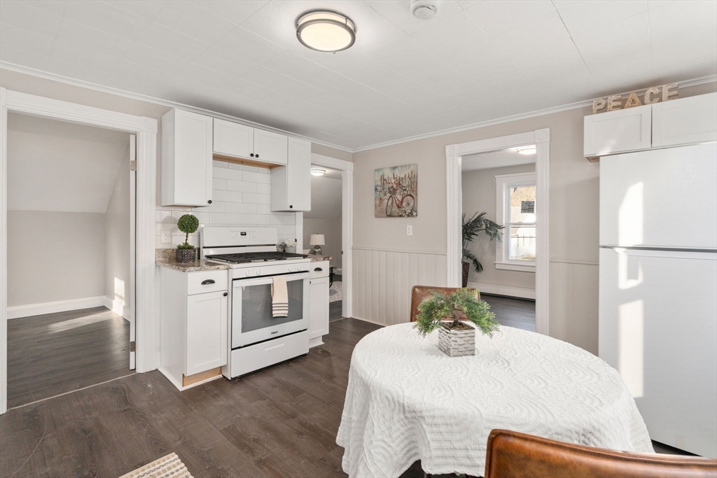 27 Dresser Street Webster, MA 01570 - Photo 21 of 33 a kitchen with a refrigerator and a stove
