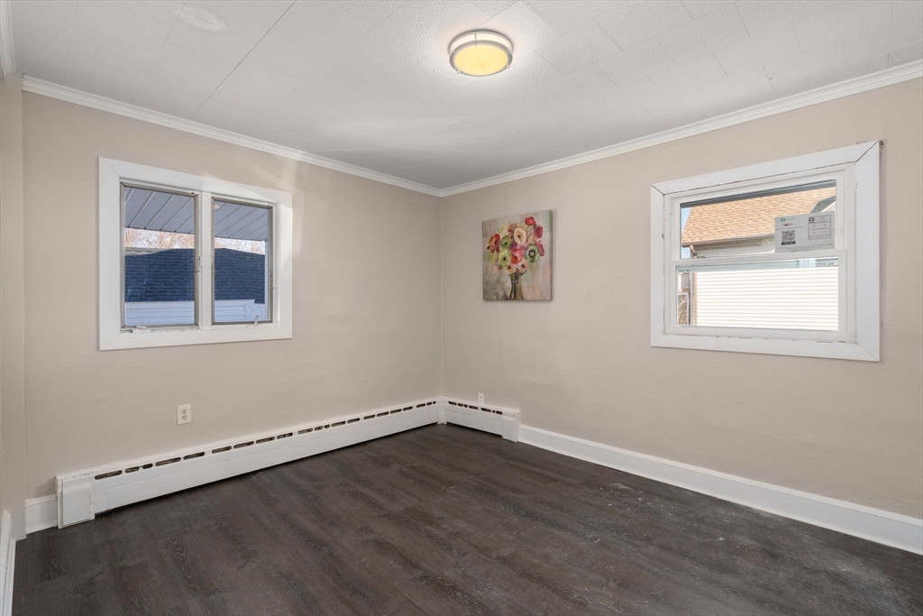 27 Dresser Street Webster, MA 01570 - Photo 25 of 33 a view of a room that has a window and wooden floor