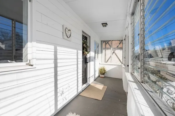a view of a balcony and a potted plant