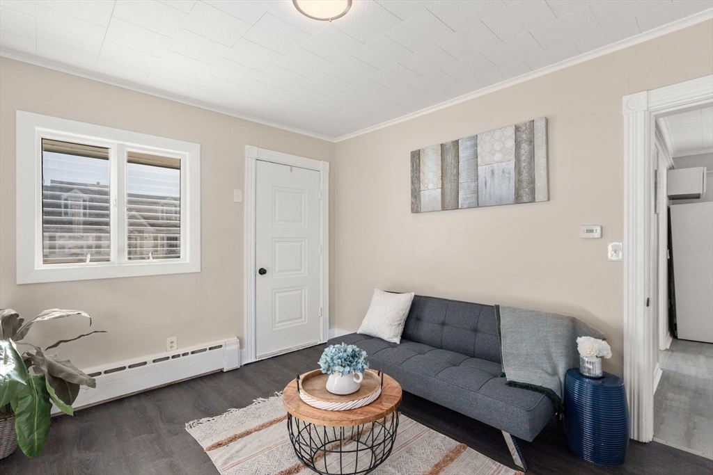 27 Dresser Street Webster, MA 01570 - Photo 5 of 33 a living room with furniture and a window