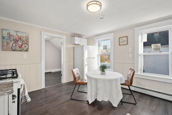 a dining room with furniture and window