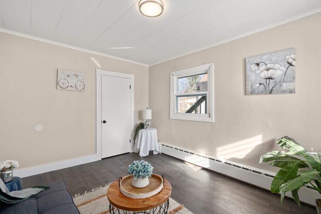 27 Dresser Street Webster, MA 01570 - Photo 9 of 33 a living room with furniture and a wooden floor