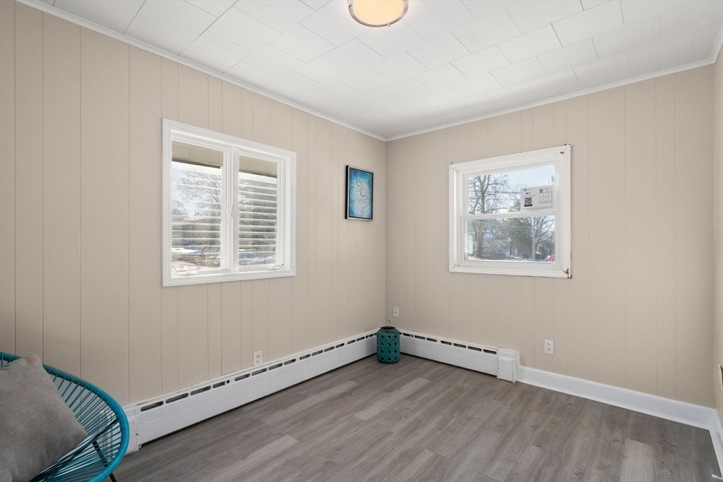 27 Dresser Street Webster, MA 01570 - Photo 10 of 33 a view of an empty room with a window and wooden floor