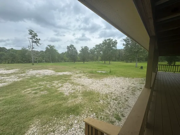 a view of balcony with wooden floor