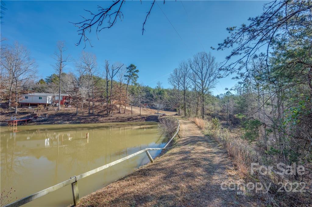 380 Happy Lane Rutherfordton, NC 28139 - Photo 13 of 45 a view of a swimming pool with a yard