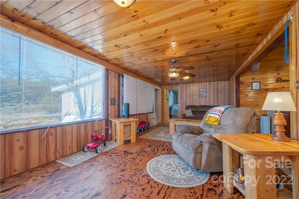 380 Happy Lane Rutherfordton, NC 28139 - Photo 22 of 45 a living room with furniture a flat screen tv and a table