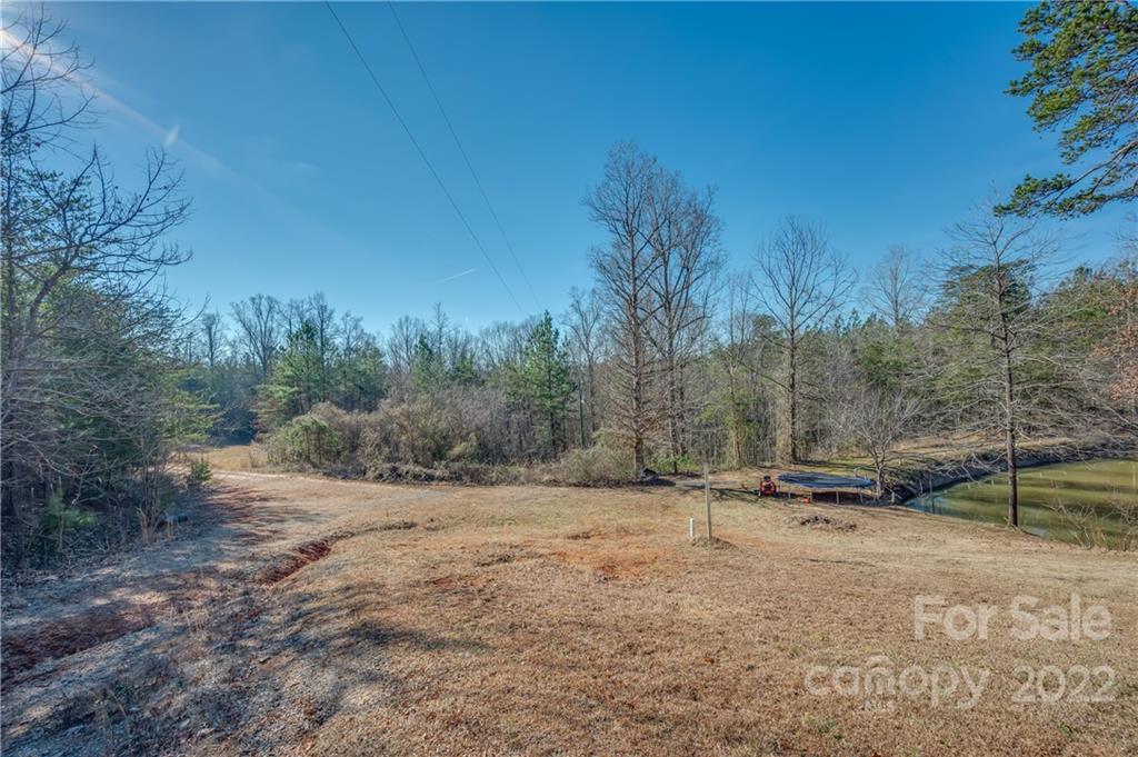 380 Happy Lane Rutherfordton, NC 28139 - Photo 3 of 45 a backyard of a house with trees