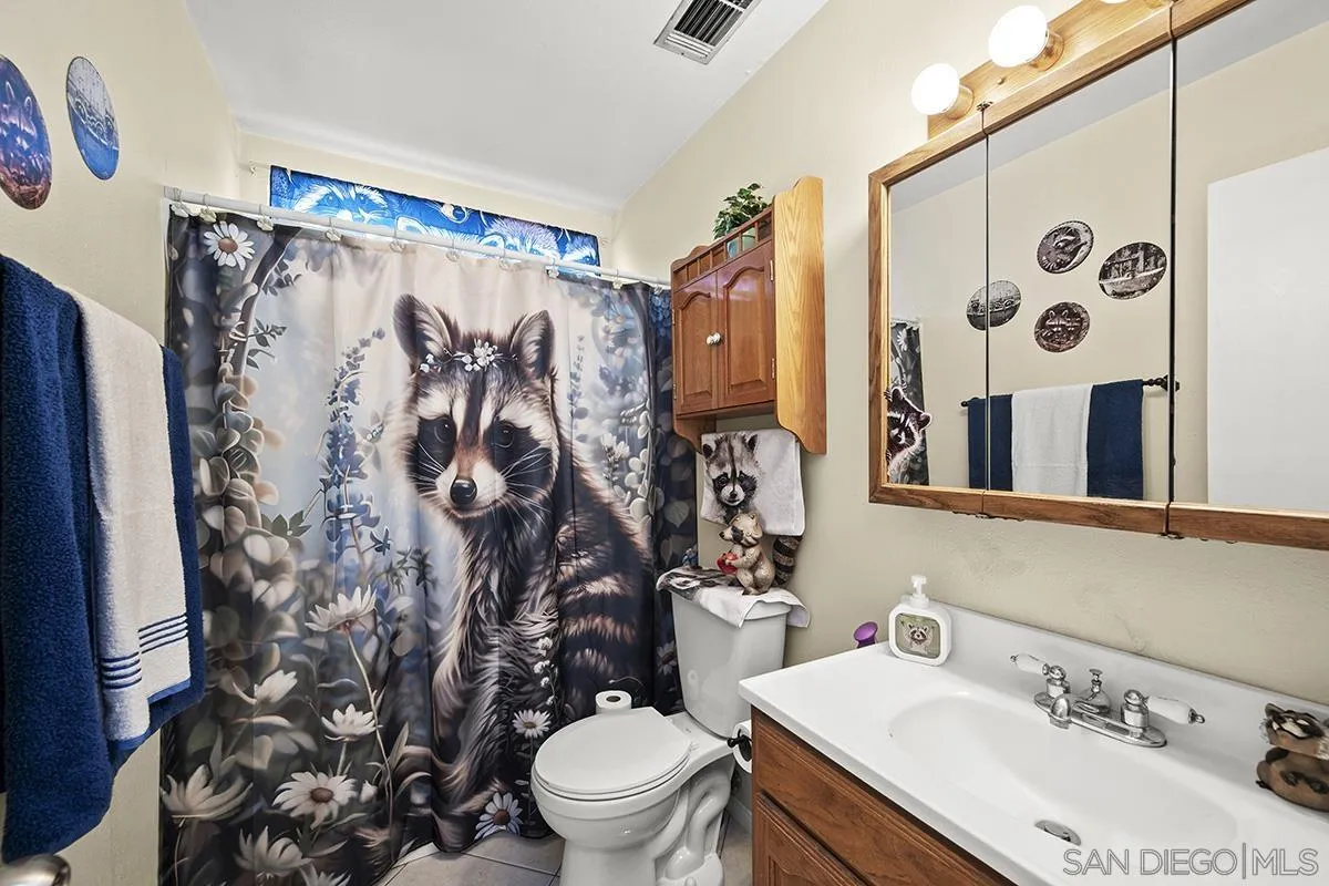 9948 Kincaid Street Santee, CA 92071 - Photo 21 of 53 a bathroom with a sink toilet and shower