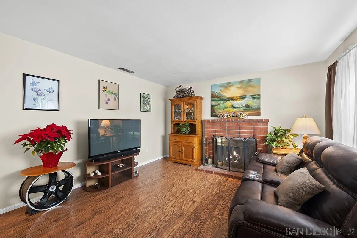 9948 Kincaid Street Santee, CA 92071 - Photo 8 of 53 a living room with furniture a window and a flat screen tv