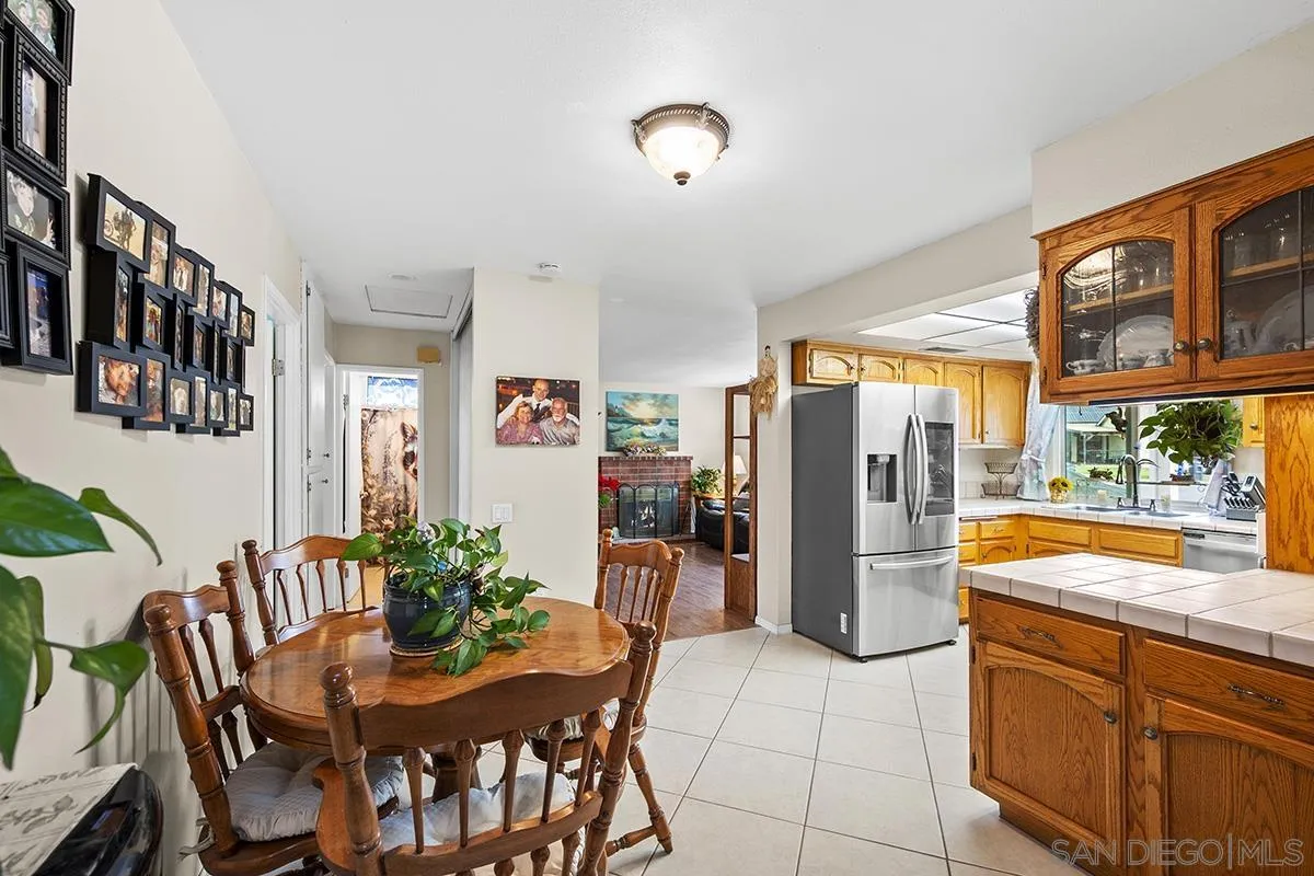 9948 Kincaid Street Santee, CA 92071 - Photo 9 of 53 a view of a dining room with furniture window and wooden floor