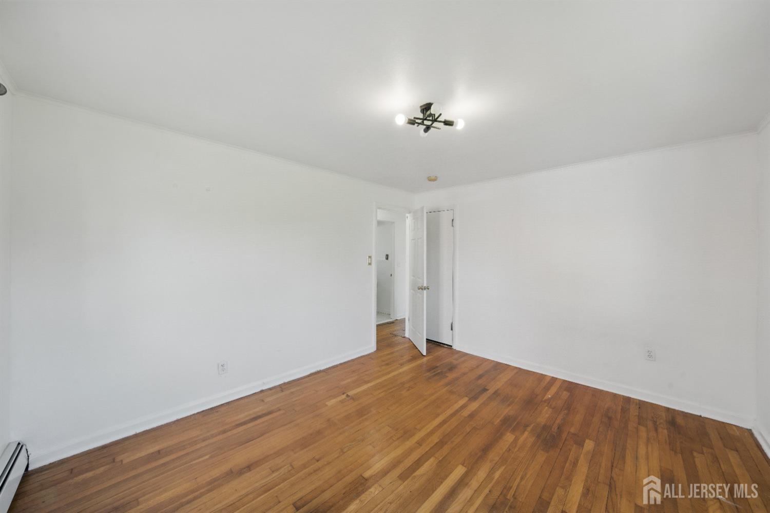 94 South Hill Road Colonia, NJ 07067 - Photo 13 of 31 wooden floor in an empty room