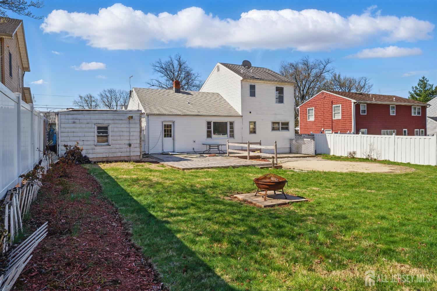 94 South Hill Road Colonia, NJ 07067 - Photo 25 of 31 a front view of a house with a yard table and chairs