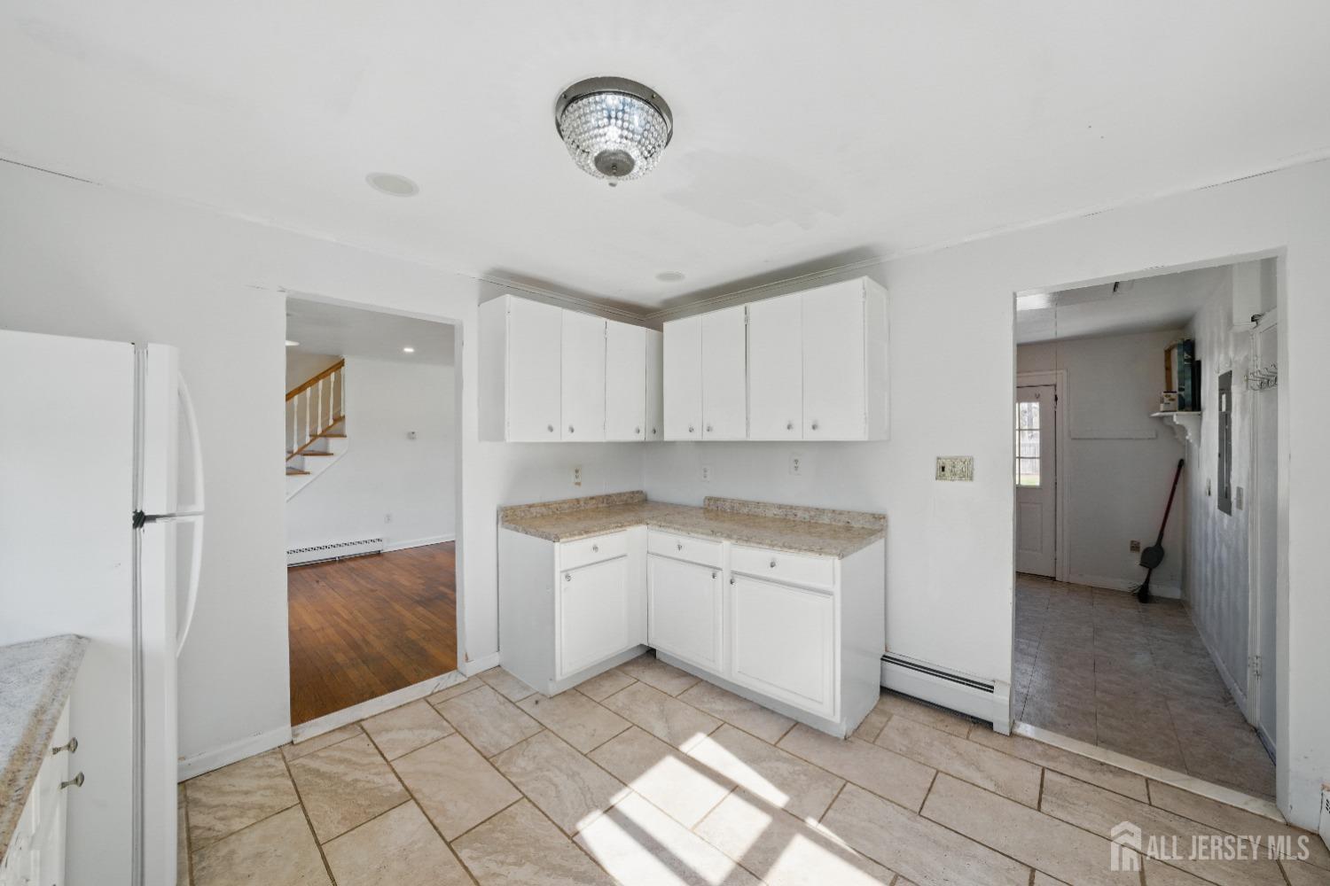 94 South Hill Road Colonia, NJ 07067 - Photo 7 of 31 a spacious bathroom with a granite countertop sink a mirror and a shower
