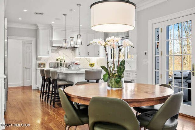 a living room with furniture fireplace and window