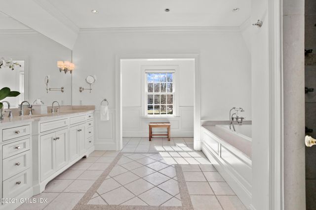 a bathroom with a sink vanity and a mirror
