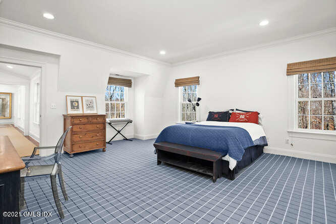 7 Desiree Drive Greenwich, CT 06830 - Photo 25 of 39 a bedroom with a bed and wooden floor