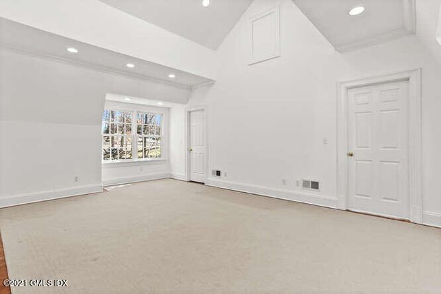 a dining room with furniture and a window
