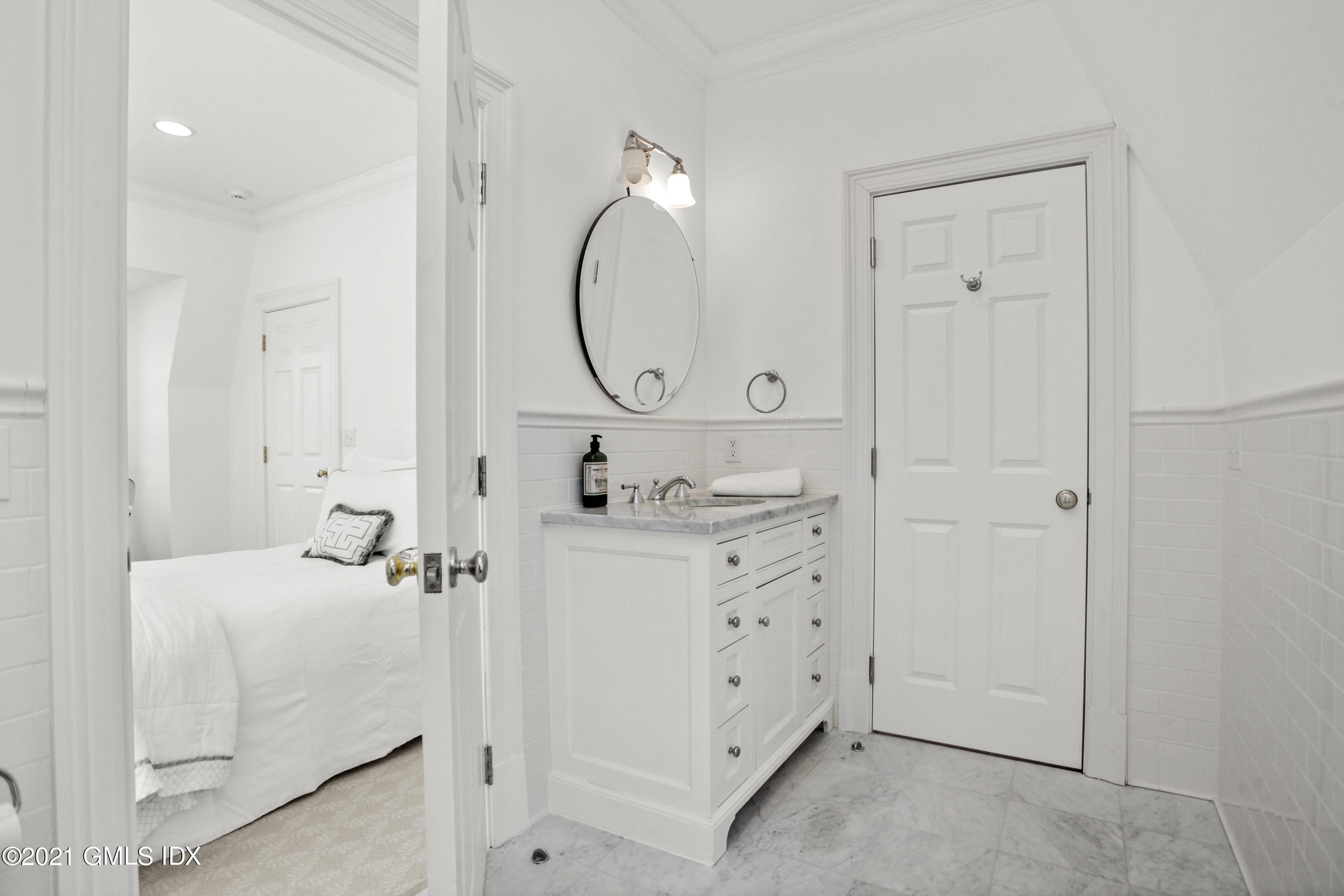 7 Desiree Drive Greenwich, CT 06830 - Photo 32 of 39 a bathroom with a sink vanity and a mirror