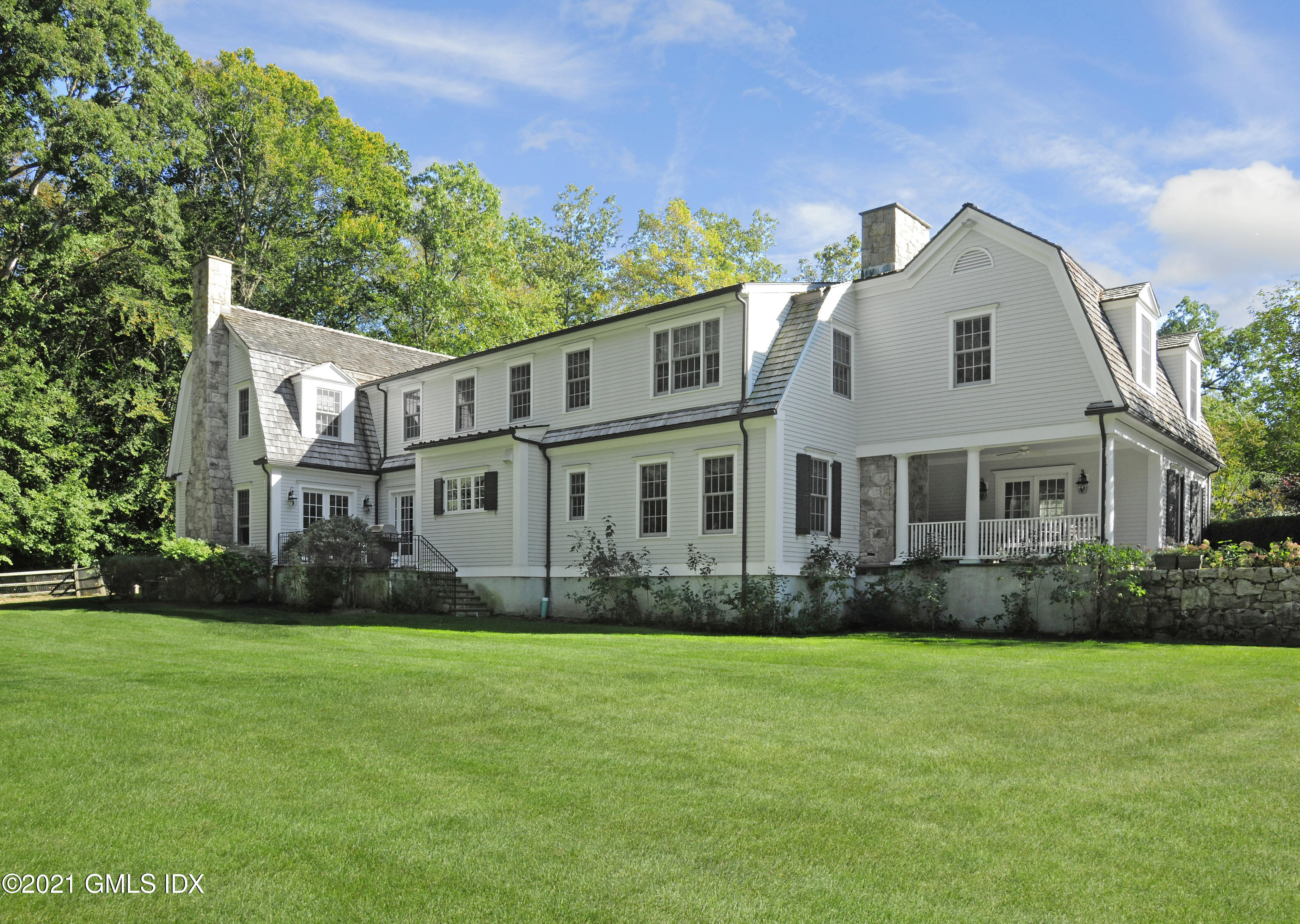 7 Desiree Drive Greenwich, CT 06830 - Photo 38 of 39 a front view of a house with garden