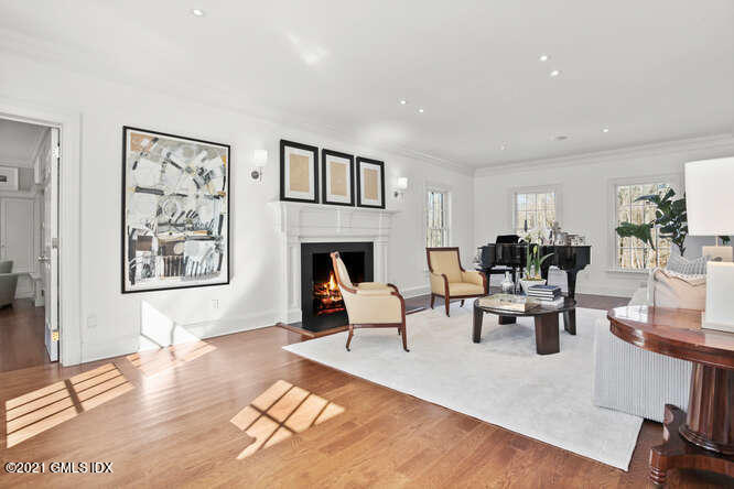 7 Desiree Drive Greenwich, CT 06830 - Photo 5 of 39 a living room with furniture dining table and a fireplace