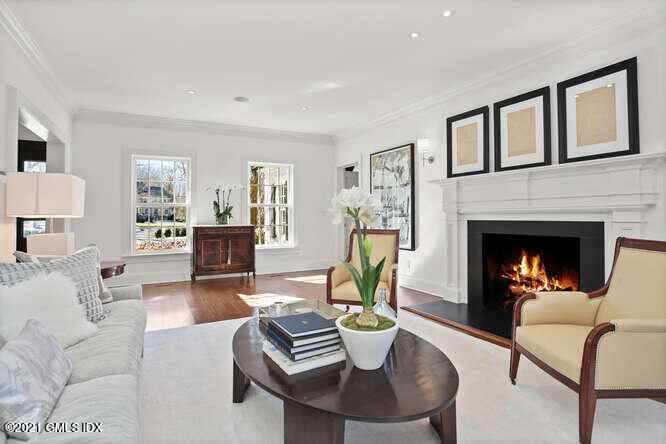 7 Desiree Drive Greenwich, CT 06830 - Photo 6 of 39 a living room with furniture a fireplace and a table