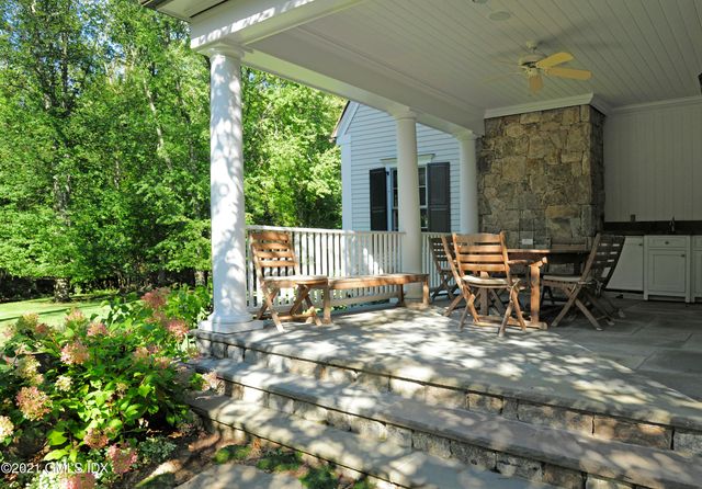 a view of two chairs in the patio