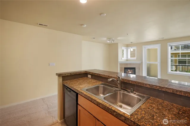 a view white cabinets and sink