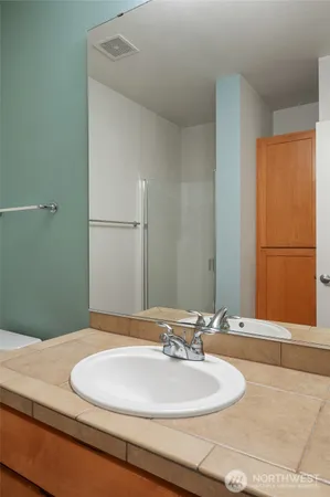 a bathroom with a sink and a mirror