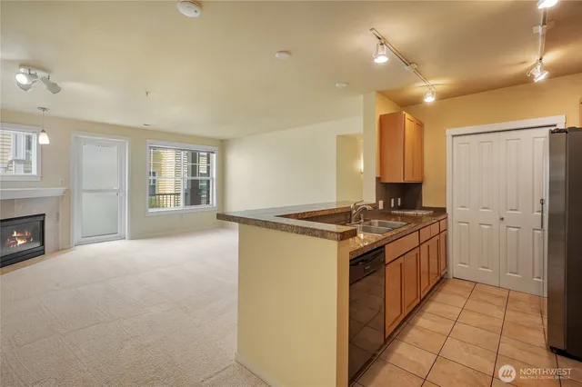 a kitchen with stainless steel appliances granite countertop a stove and a refrigerator
