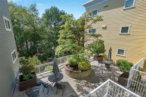 a view of a chair and table in backyard