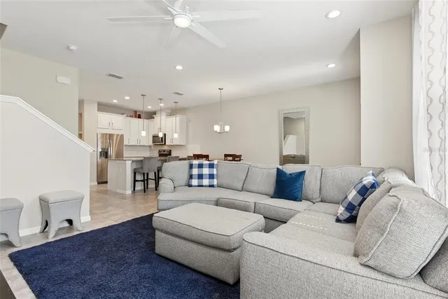 a view of kitchen with kitchen island dining table and stainless steel appliances
