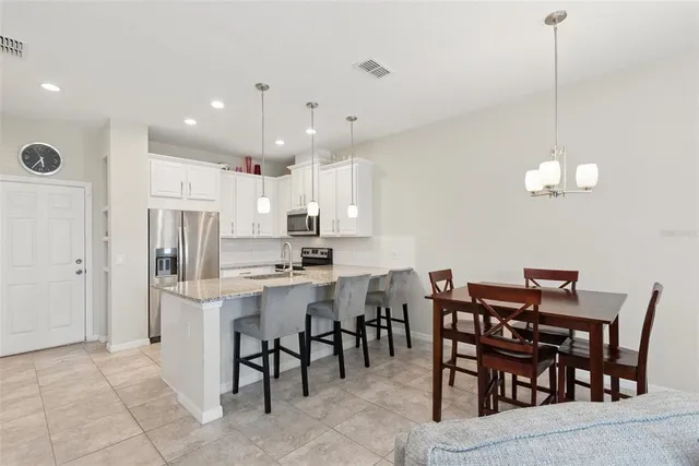 a view of a dining room with furniture