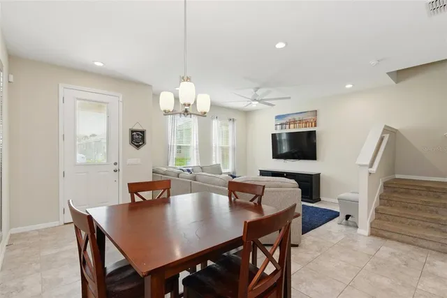 a kitchen with stainless steel appliances granite countertop a sink refrigerator and microwave