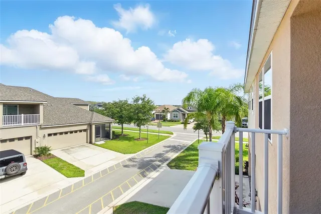 a bed room with a bed and a large window
