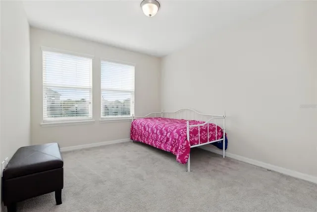 a view of a house with a garden and pathway