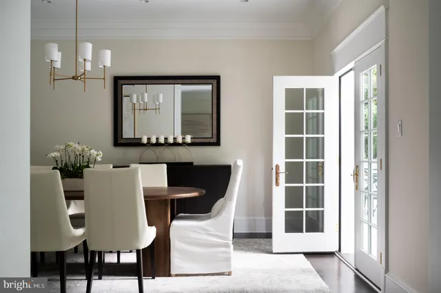 a living room with furniture fireplace and a table