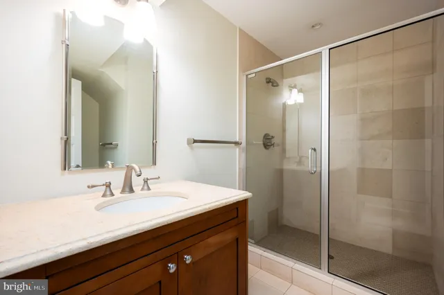 a view of an empty room with a fireplace and a large window