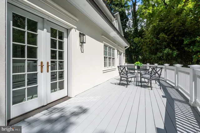 a view of deck with table and chairs and wooden floor