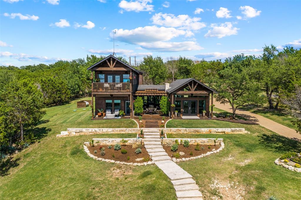 124 Bluffview Circle China Spring, TX 76633 - Photo 4 of 40 Rustic modern architecture with dark wood siding and exposed timber accents