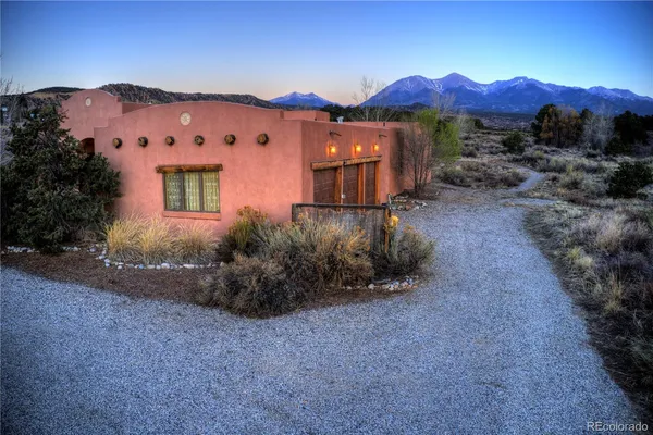 a view of a large building with a mountain in the background