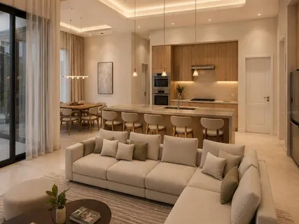 a living room with furniture kitchen view and a window