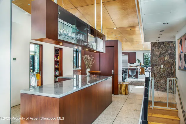 a living room with furniture and a swimming pool