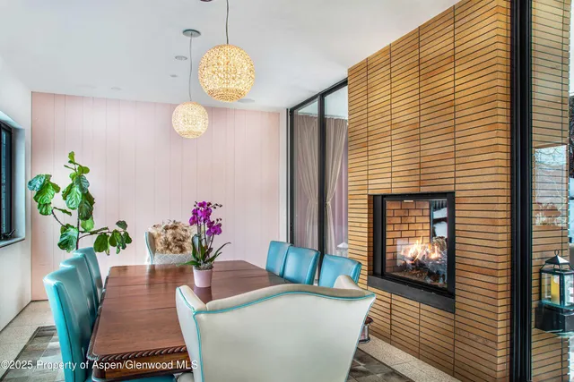 a view of a kitchen with a table and chairs
